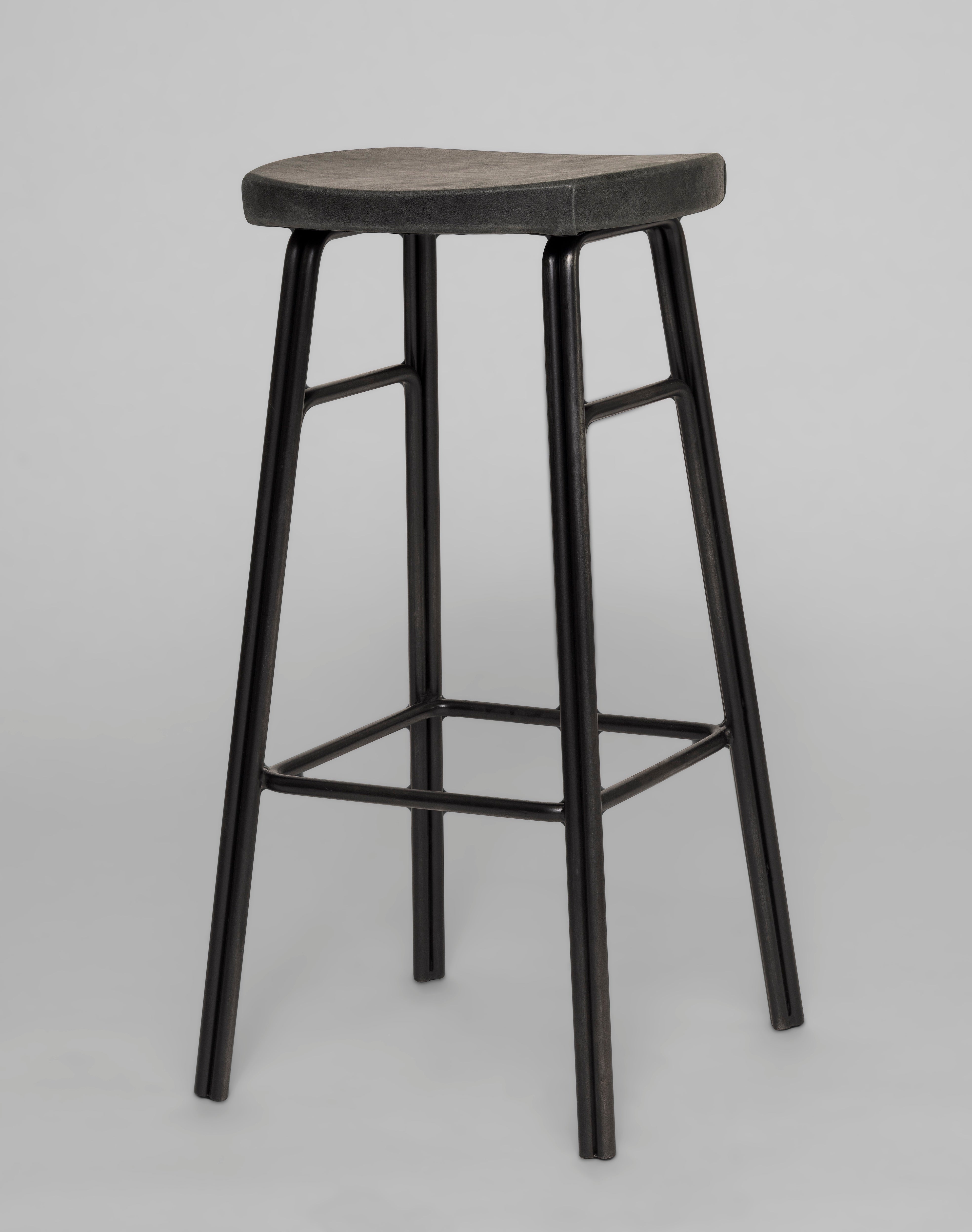 Daley Bar Stool Shown in Midnight metal finish with Distressed Paprika leather